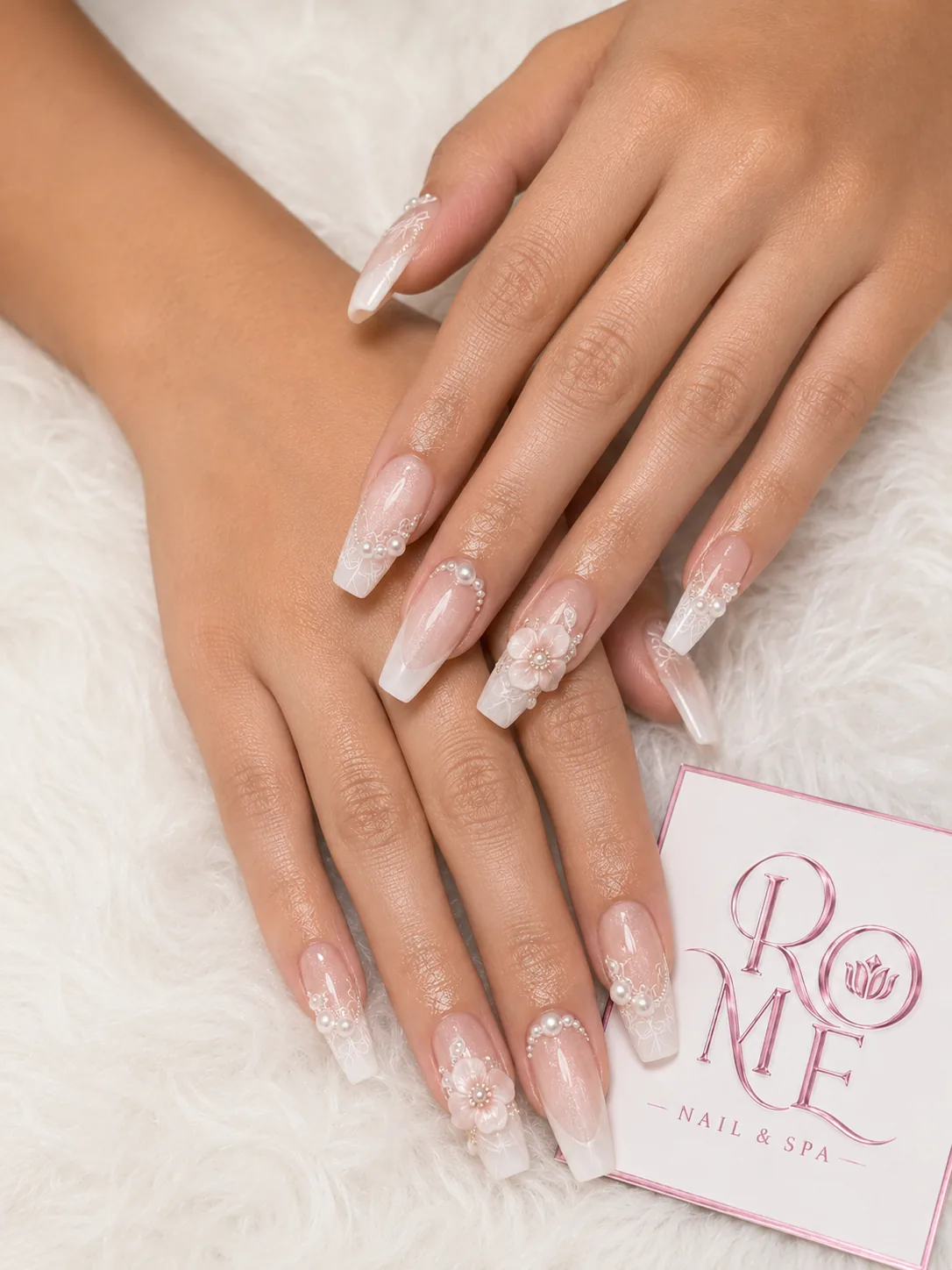 Burgundy French almond nails with floral accents by Rome Nails Spa