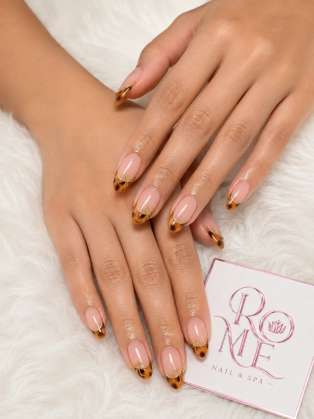 Warm tortoiseshell French almond nails by Rome Nails Spa