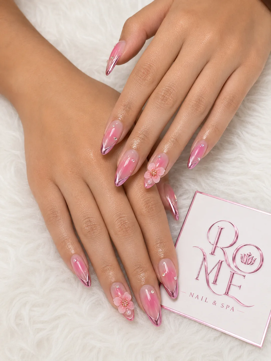 Bright pink almond nails with flowing swirl details by Rome Nails Spa