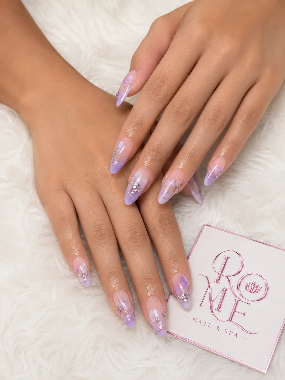 Lilac shimmer almond nails with crystal details by Rome Nails Spa