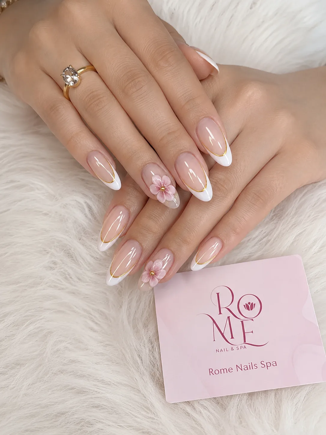 Soft white swirl almond nails with blush details by Rome Nails Spa