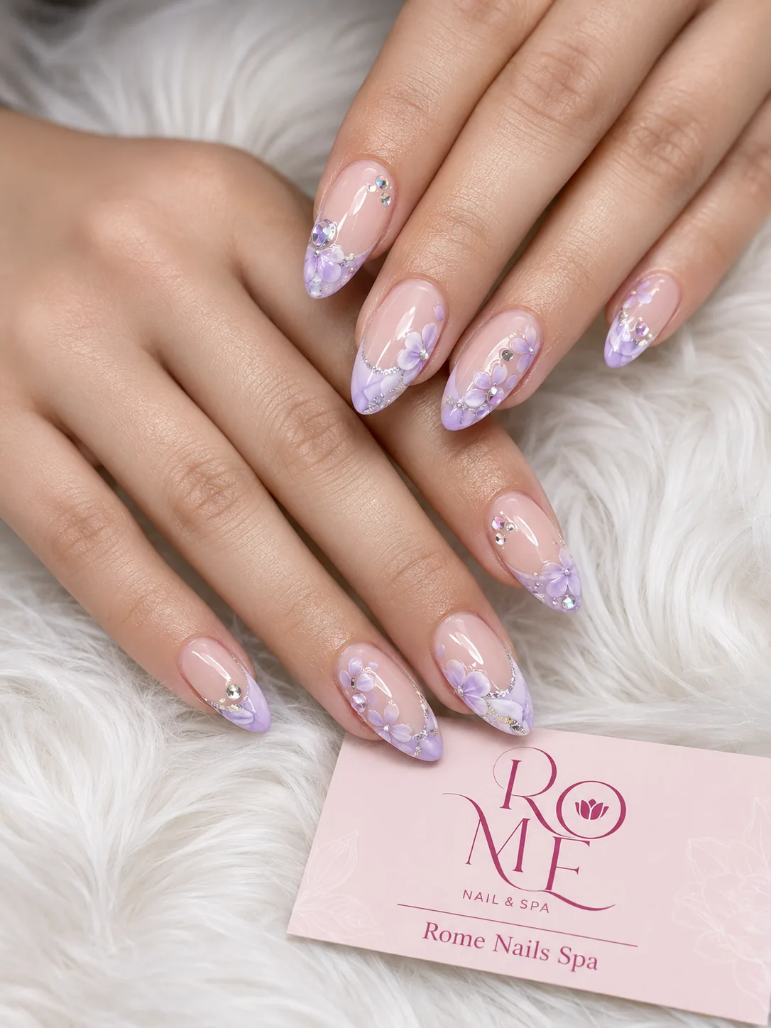 Lilac floral almond nails with shimmer details by Rome Nails Spa