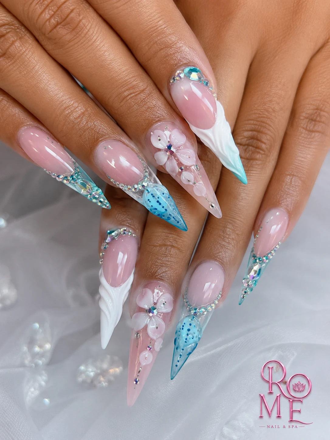 Aqua and white sculpted floral nail art by Rome Nails Spa